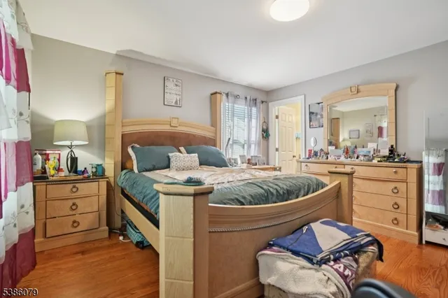 a living room with furniture and a dresser