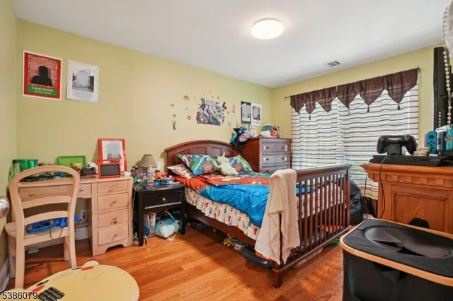 a bedroom with furniture and a window