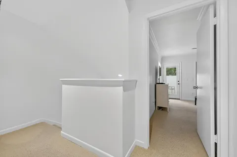 a white toilet sitting next to a bath tub