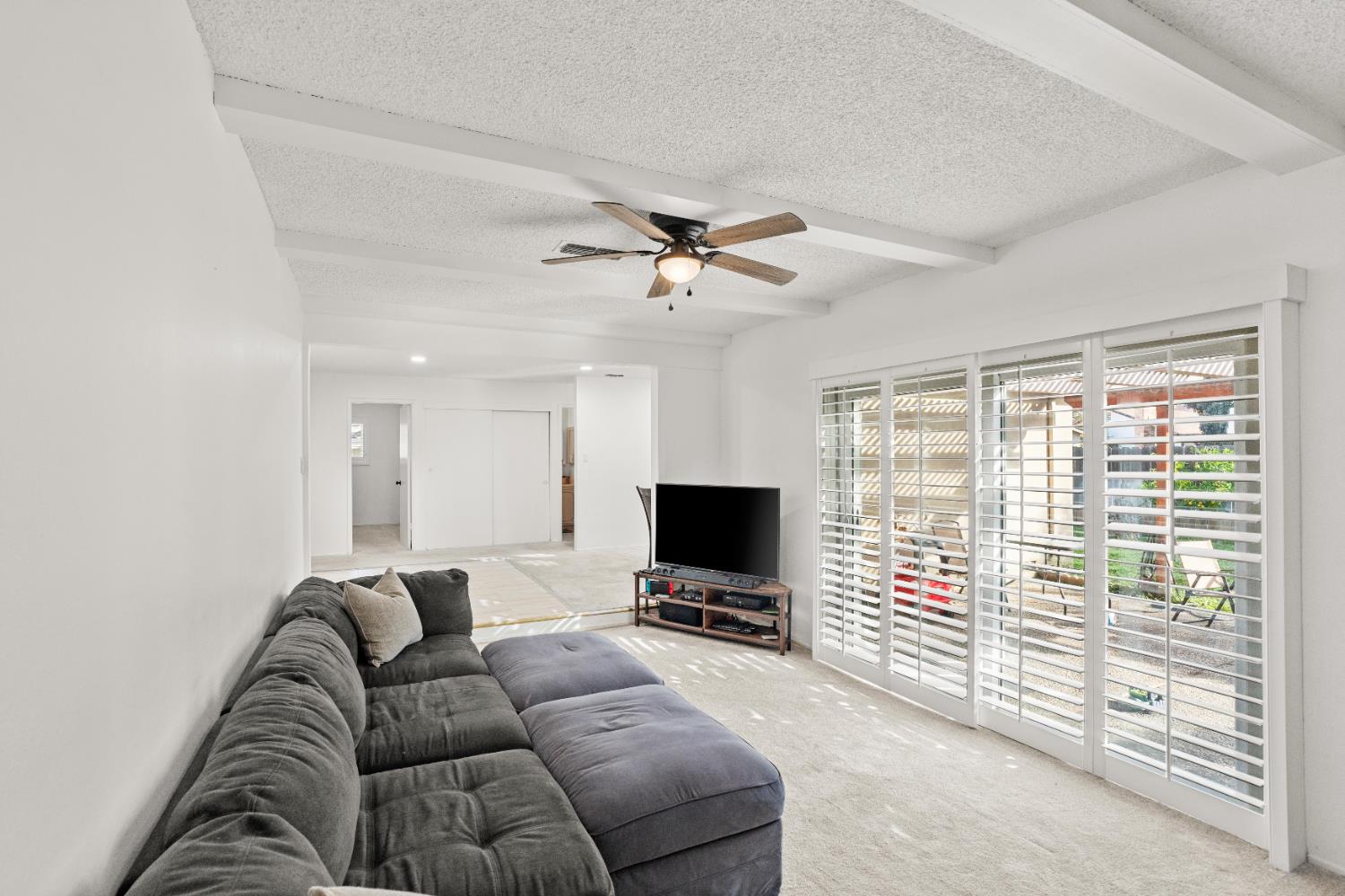 3412 Huntsman Drive Sacramento, CA 95826 - Photo 11 of 32 a living room with furniture a ceiling fan and a window