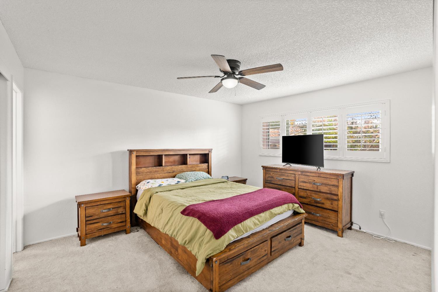 3412 Huntsman Drive Sacramento, CA 95826 - Photo 18 of 32 a bedroom with a bed and a flat screen tv