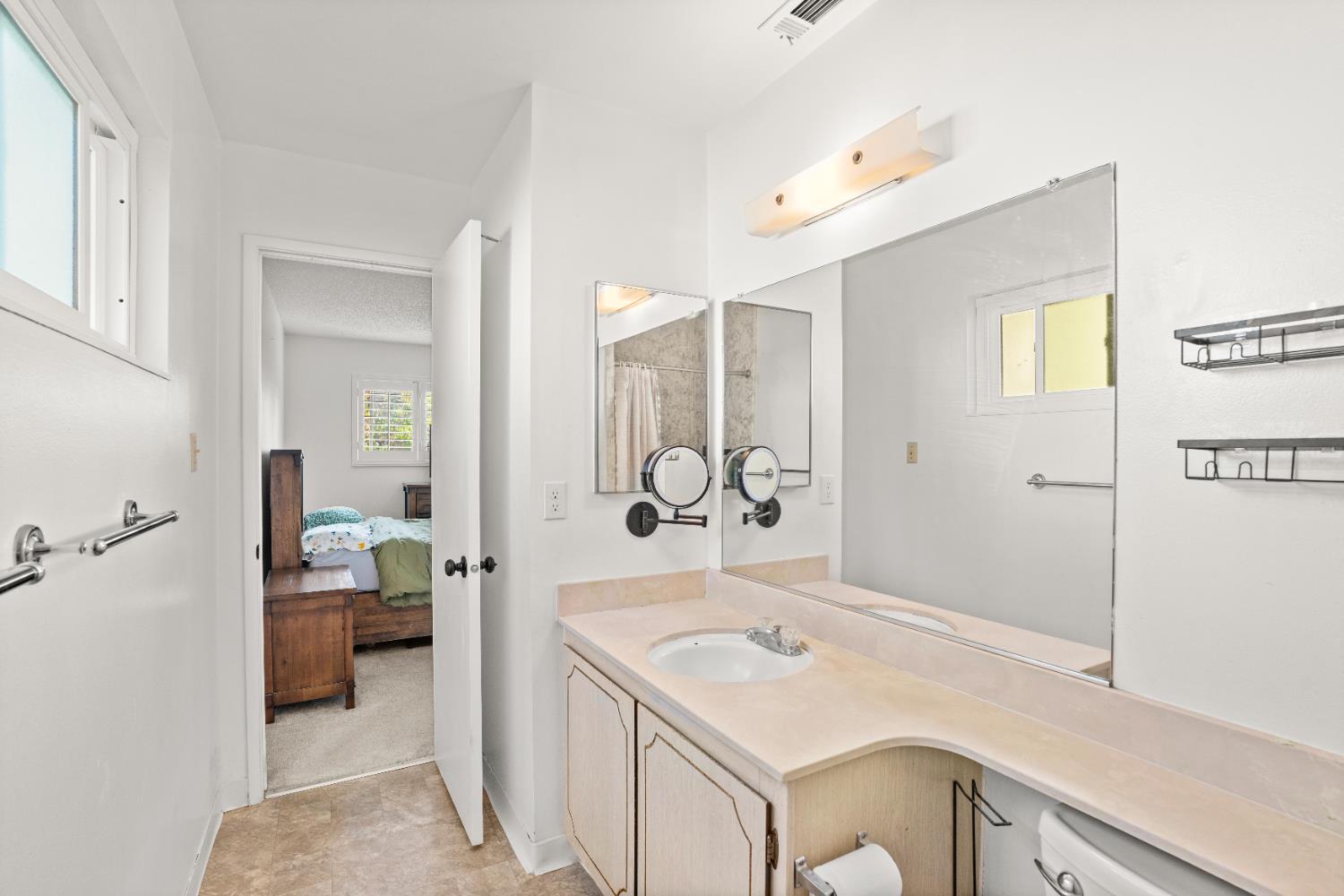 3412 Huntsman Drive Sacramento, CA 95826 - Photo 20 of 32 a en suite bathroom with a sink and mirror