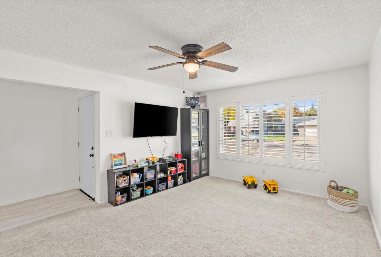 3412 Huntsman Drive Sacramento, CA 95826 - Photo 4 of 32 a living room with furniture and a flat screen tv