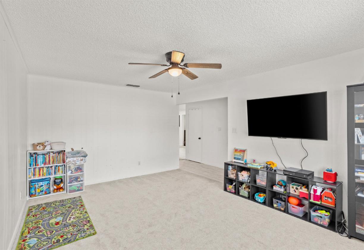 3412 Huntsman Drive Sacramento, CA 95826 - Photo 5 of 32 a living room with furniture and a flat screen tv