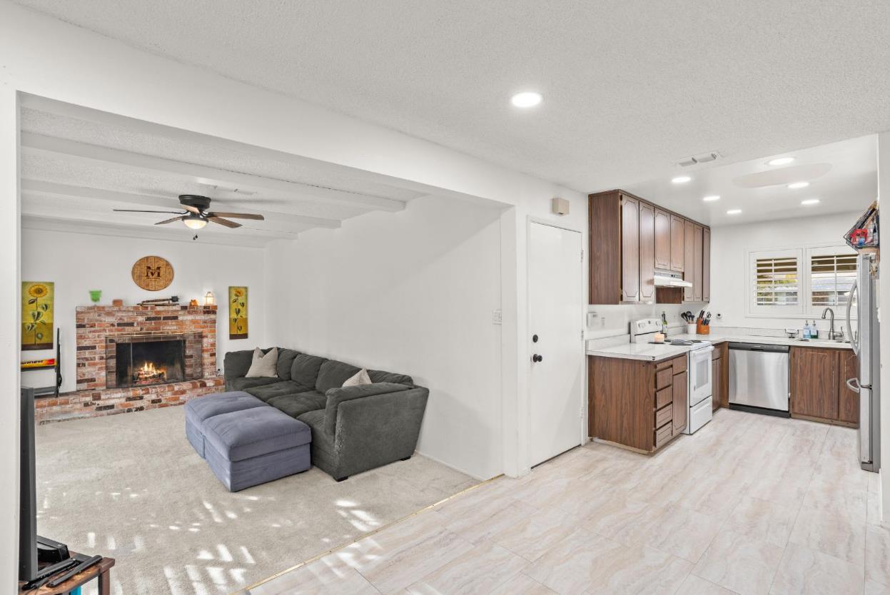 3412 Huntsman Drive Sacramento, CA 95826 - Photo 7 of 32 a living room with furniture and a fireplace