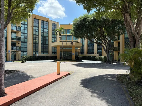 a view of an empty room with glass door