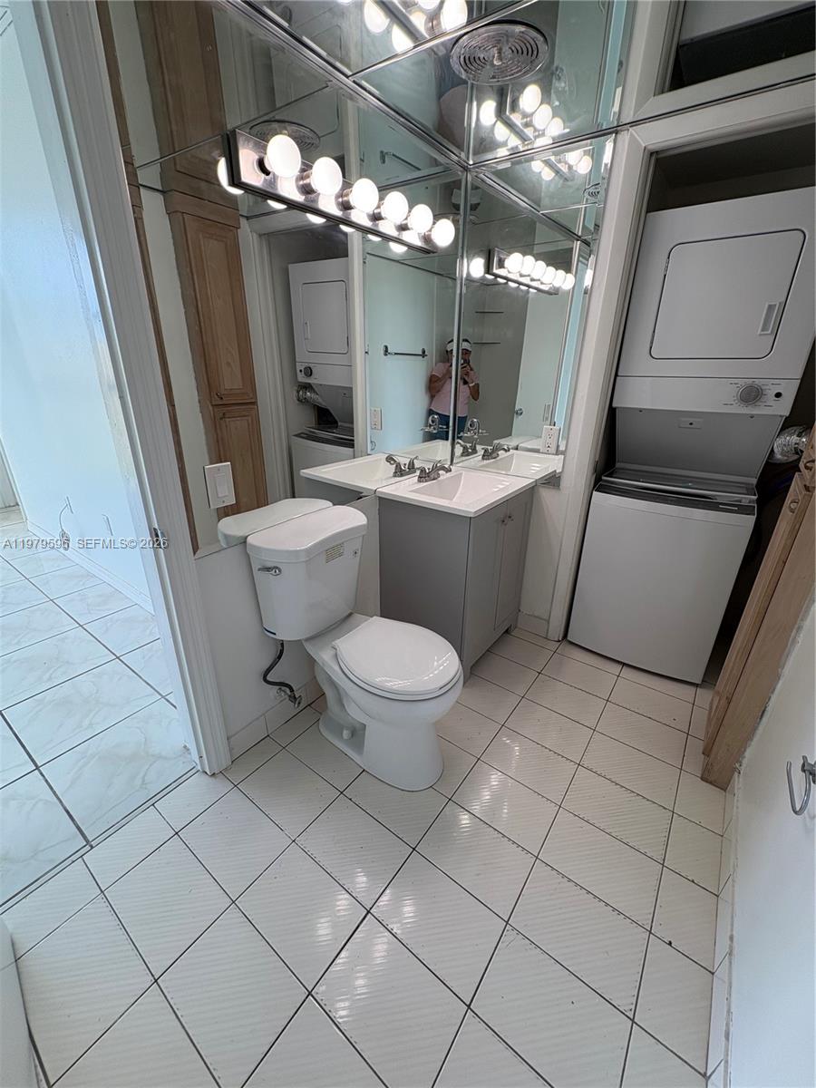 11800 Southwest 18th Street, Unit 5174 Miami, FL 33175 - Photo 15 of 22 a bathroom with a toilet sink and mirror
