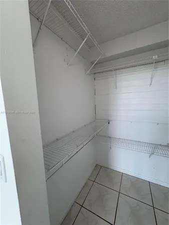 a view of backyard with swimming pool and outdoor seating