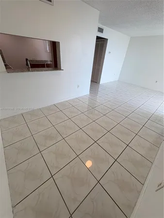 a view of an empty room and utility room
