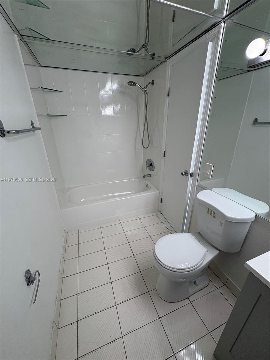 11800 Southwest 18th Street, Unit 5174 Miami, FL 33175 - Photo 8 of 22 a bathroom with a toilet and a shower