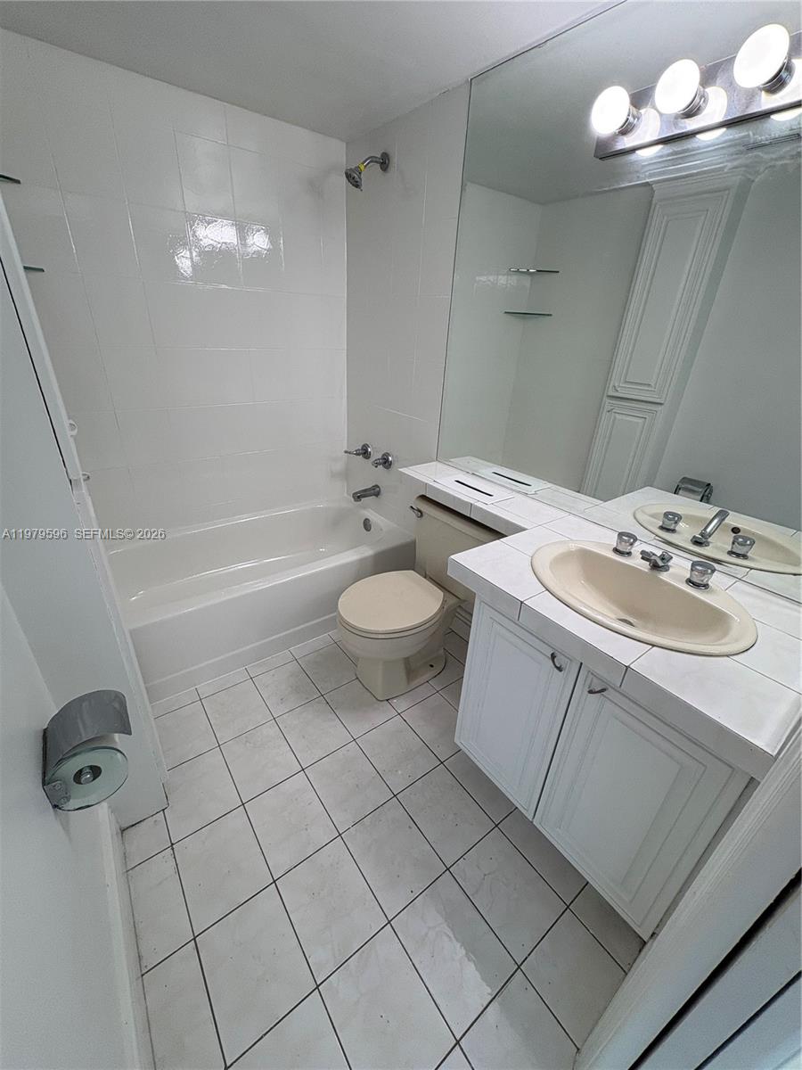 11800 Southwest 18th Street, Unit 5174 Miami, FL 33175 - Photo 10 of 22 a bathroom with a sink toilet and shower