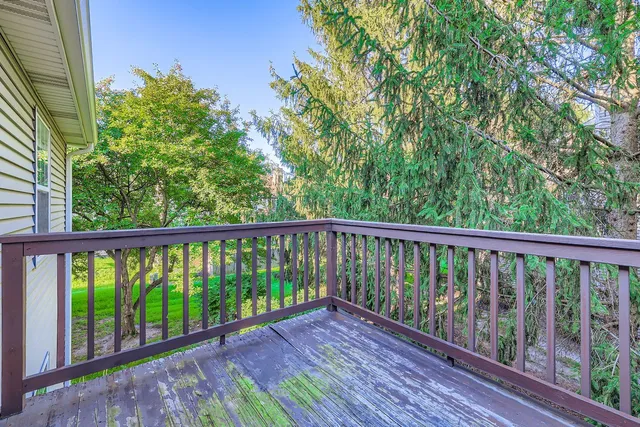 a view of balcony with wooden floor