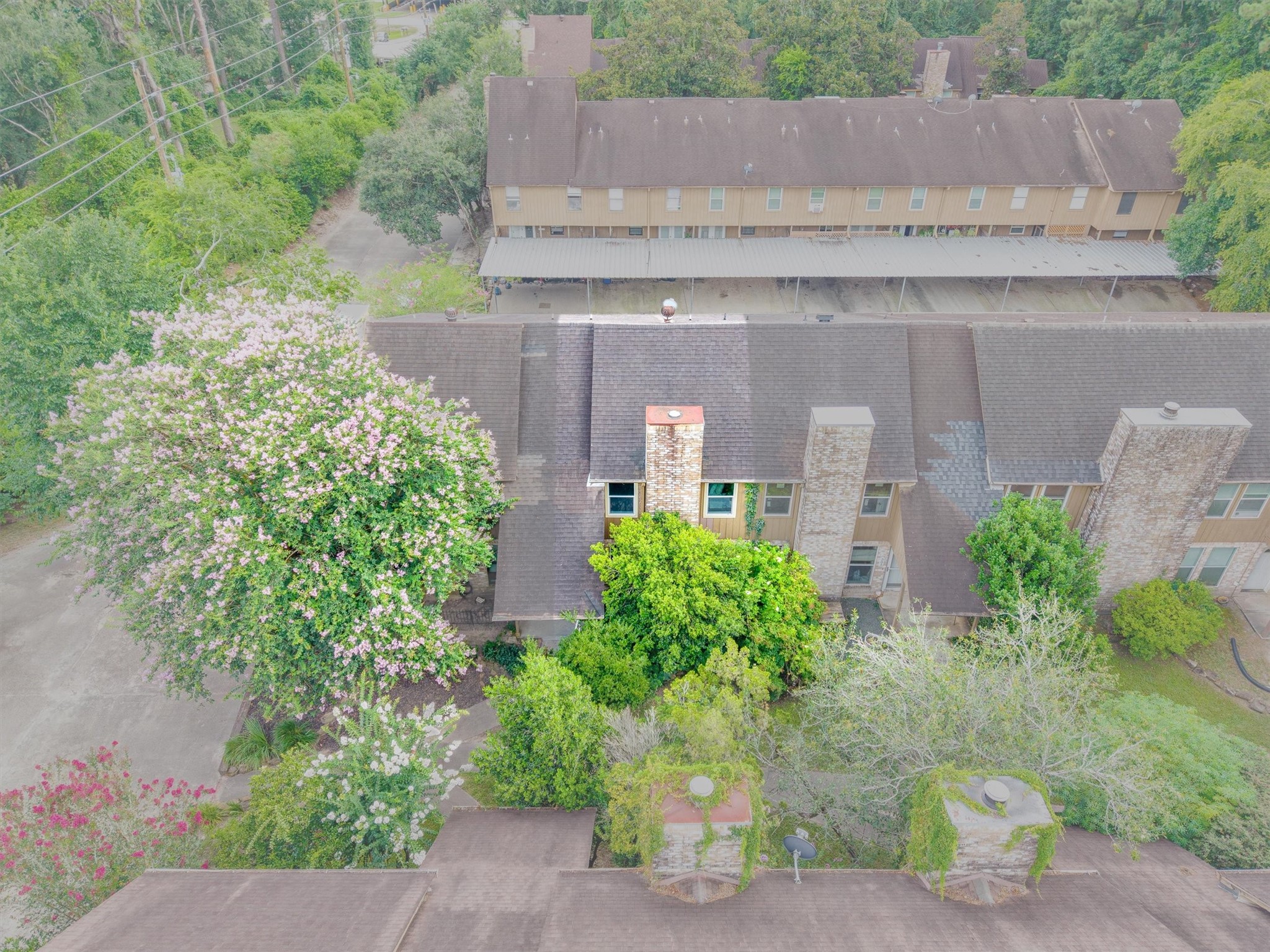 1011 Hamblen Road, Unit 306 Houston, TX 77339 - Photo 30 of 38 This angle pulls back a bit further, showing just how much greenery surrounds the home, a peaceful setting that still feels close to everything.