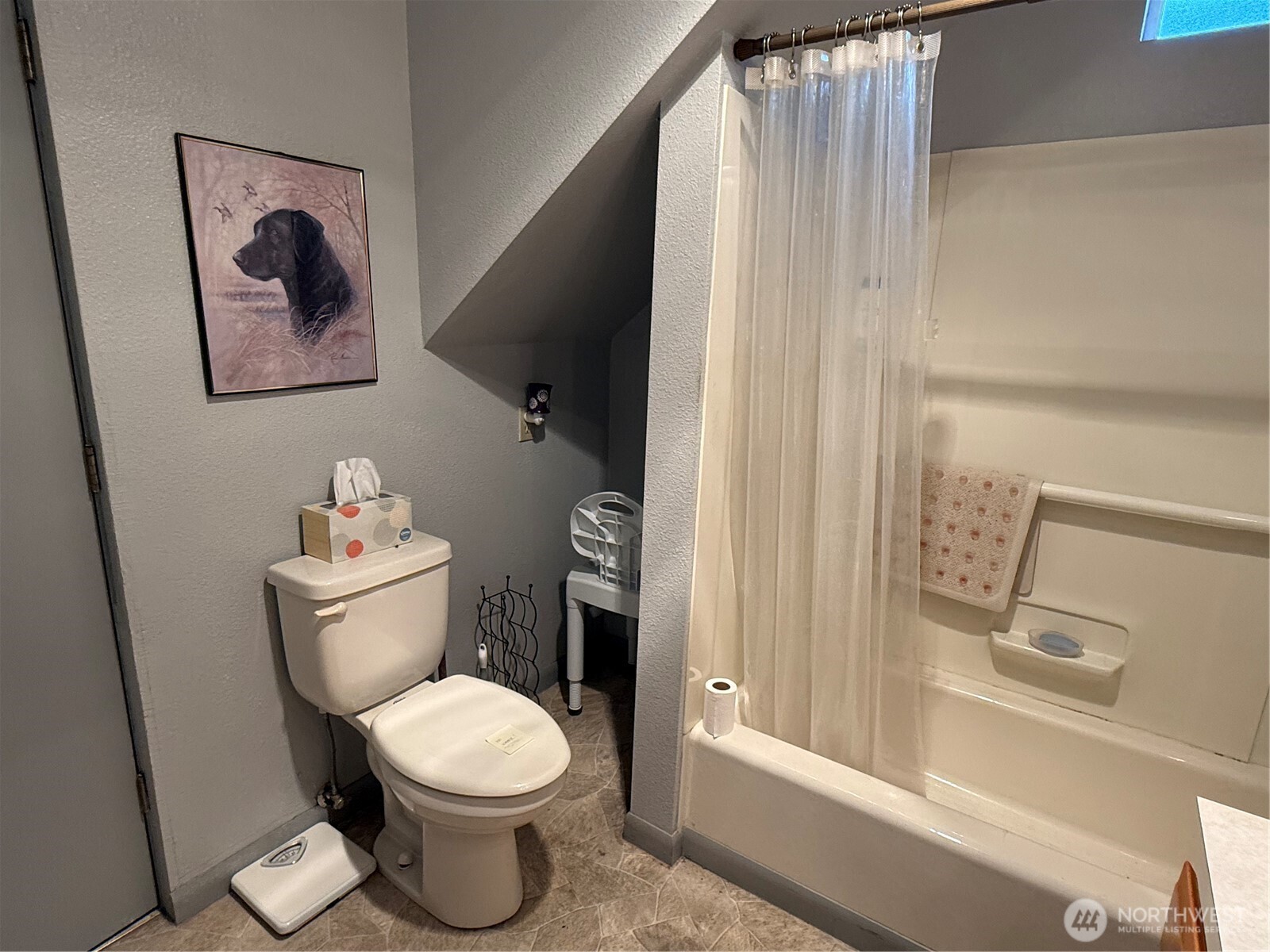 1907 Simpson Avenue Aberdeen, WA 98520 - Photo 11 of 17 a white toilet sitting next to a bathroom sink and tub