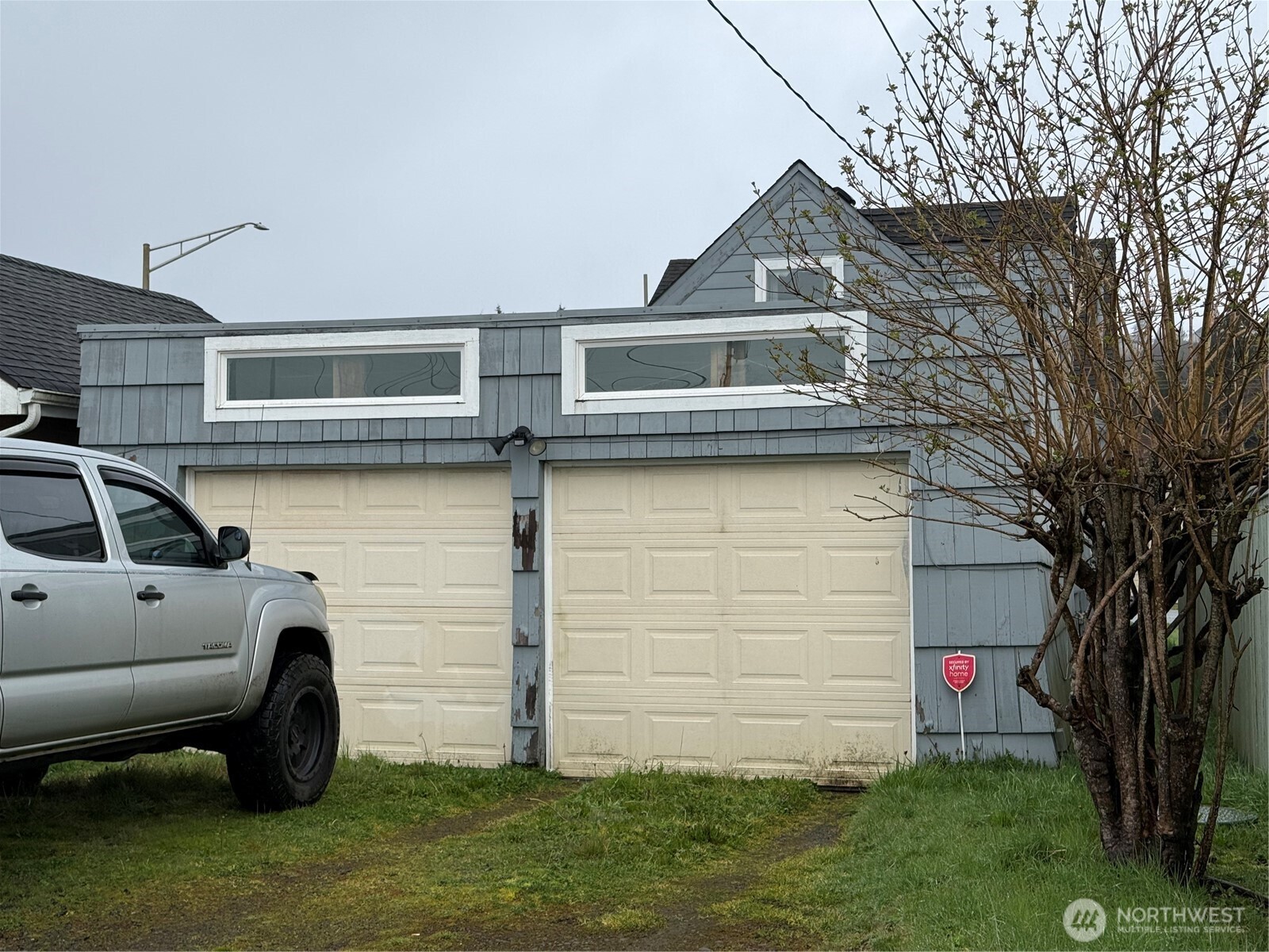 1907 Simpson Avenue Aberdeen, WA 98520 - Photo 15 of 17 a front view of a house with a yard