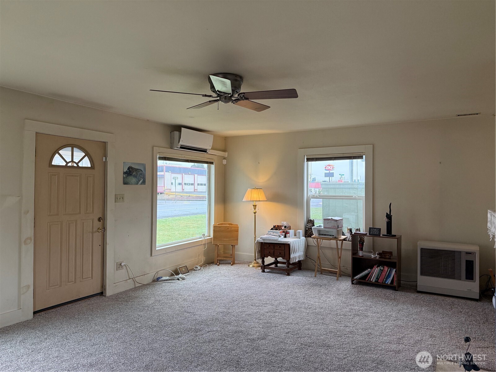 1907 Simpson Avenue Aberdeen, WA 98520 - Photo 2 of 17 a living room with furniture a window and a ceiling fan