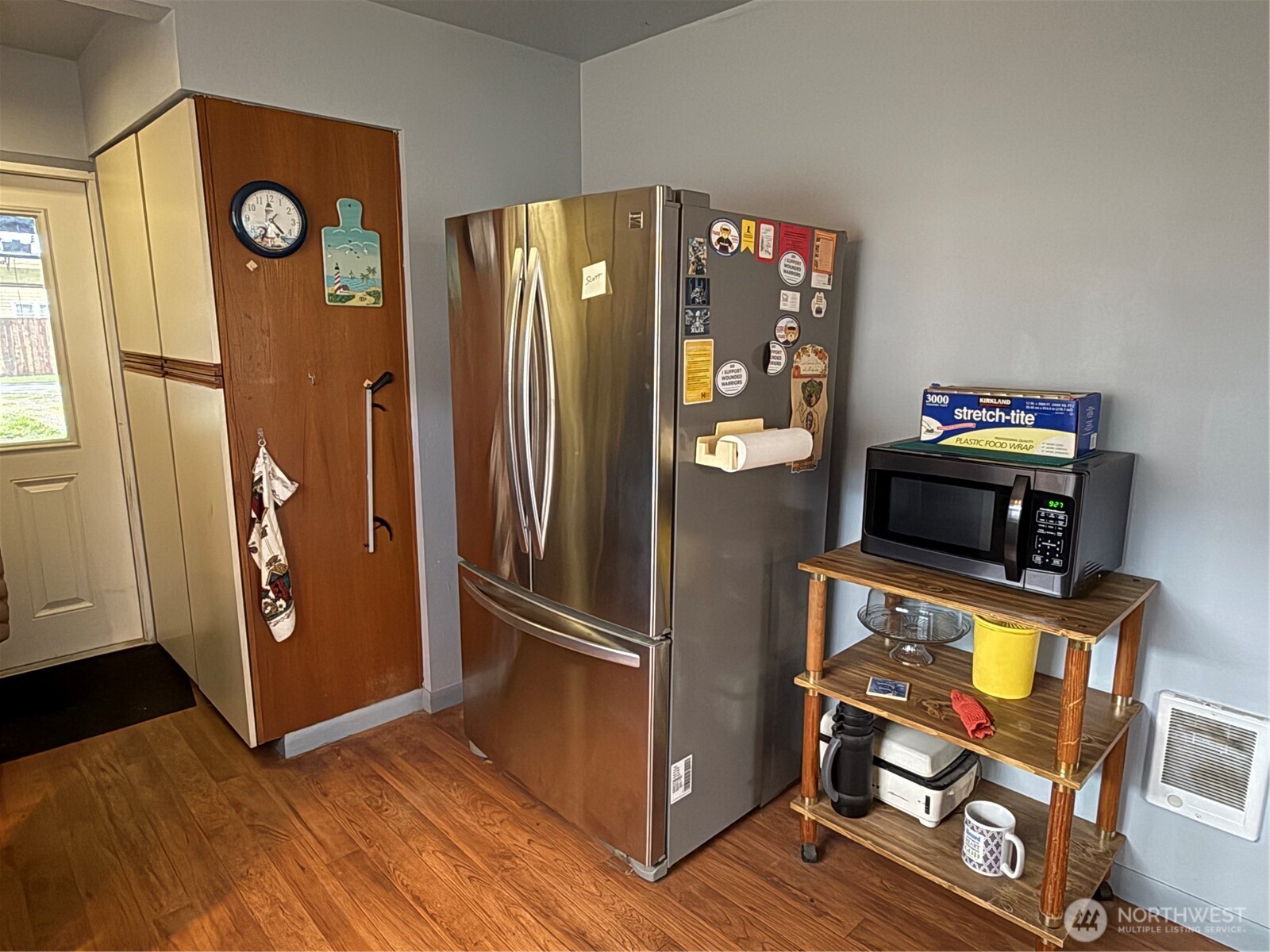 1907 Simpson Avenue Aberdeen, WA 98520 - Photo 7 of 17 a view of a refrigerator in kitchen and wooden floor