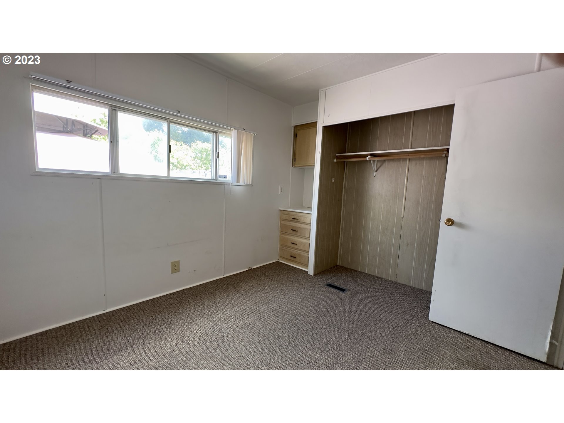 1695 Harbor Drive Springfield, OR 97477 - Photo 12 of 26 a open hall with a cabinet and stairs