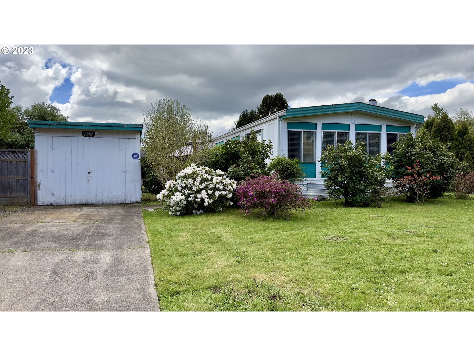 1695 Harbor Drive Springfield, OR 97477 - Photo 2 of 26 a black and white photo of a house