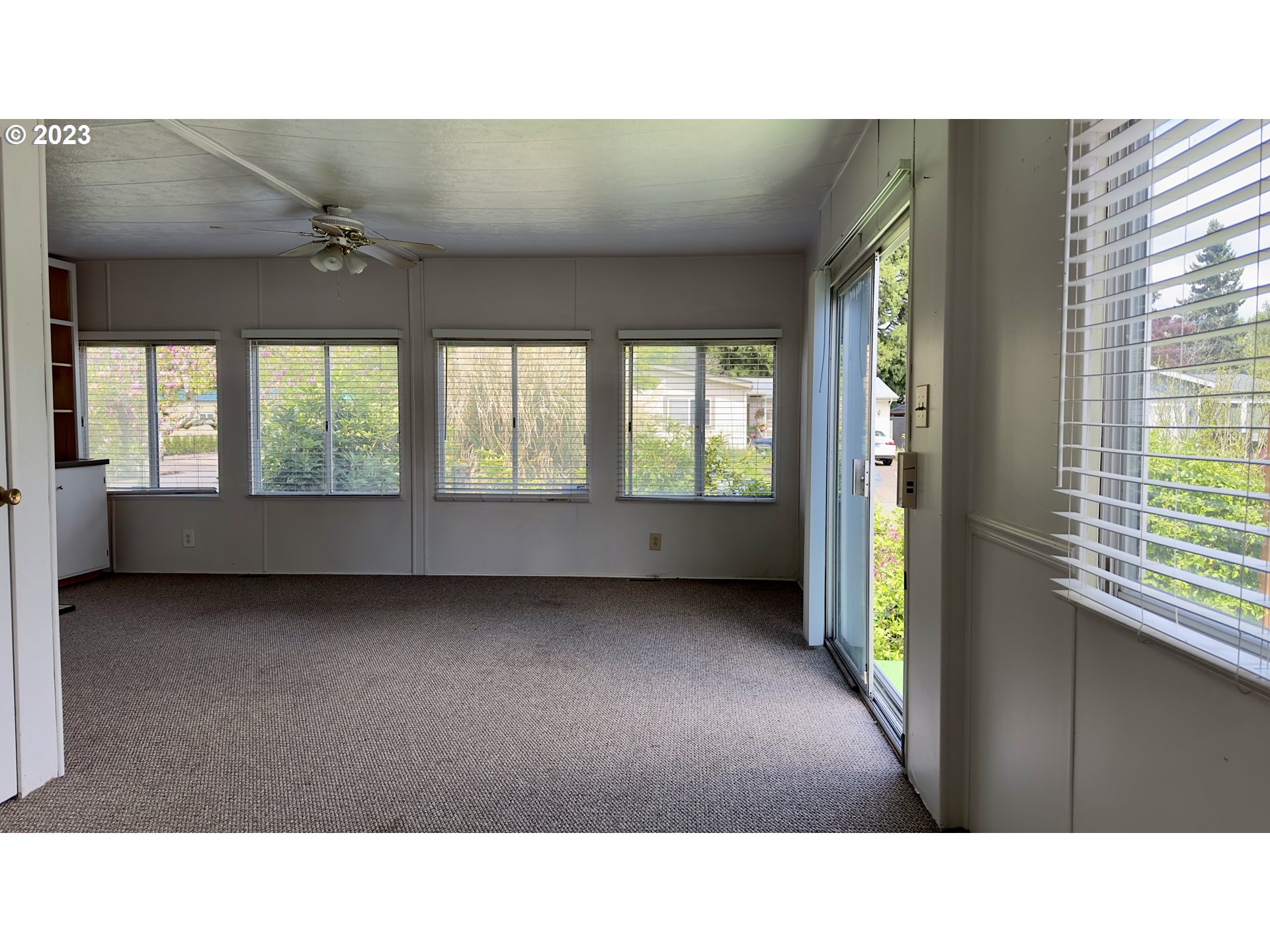 1695 Harbor Drive Springfield, OR 97477 - Photo 7 of 26 a open hall with a floor to ceiling window and kitchen