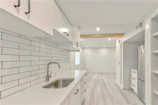 a bathroom with a sink and a shower