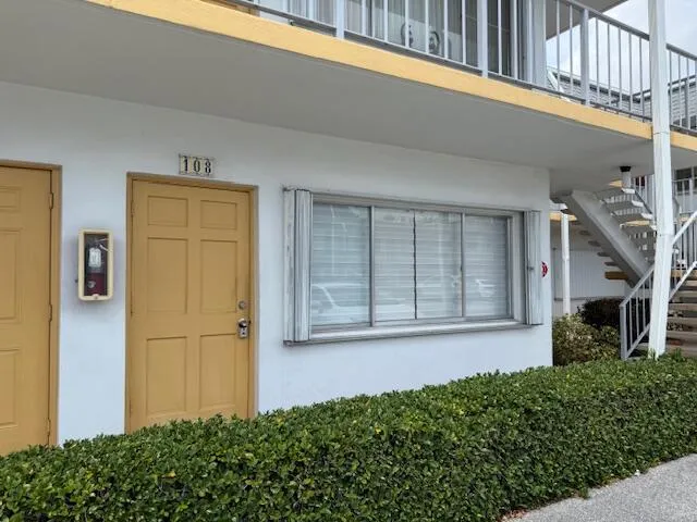 a front view of a house with a garage