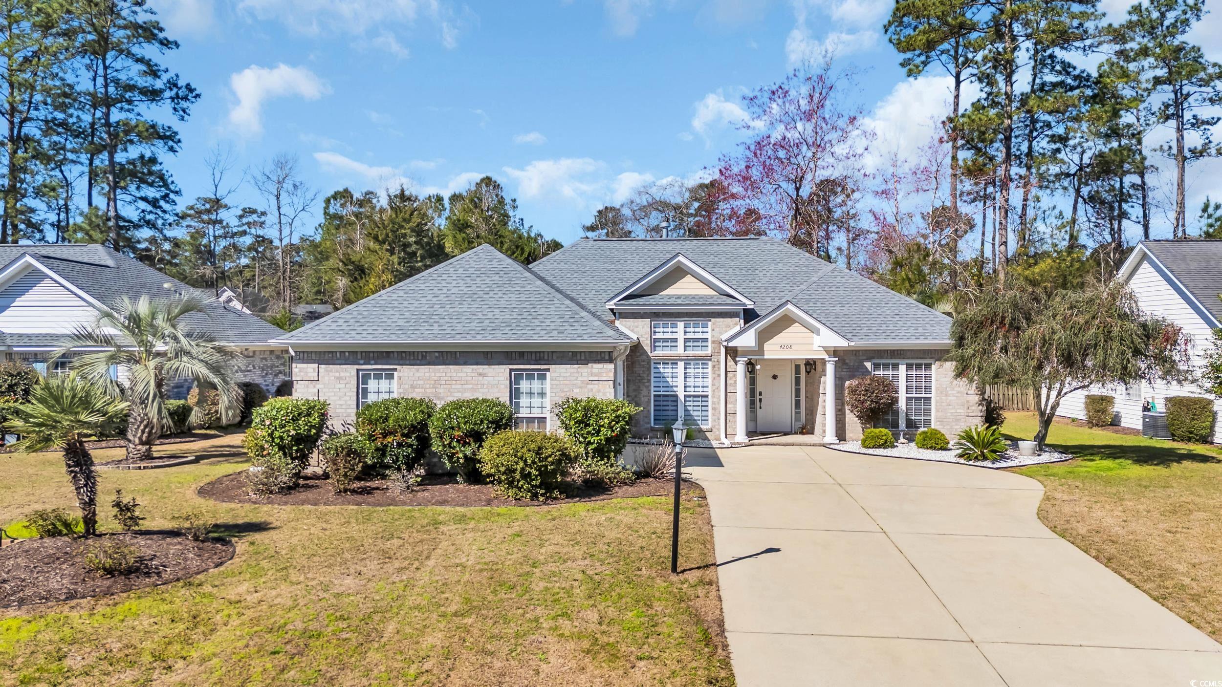 4208 Edgefield Road Little River, SC 29566 - Photo 1 of 33 View of front facade featuring brick siding, concr