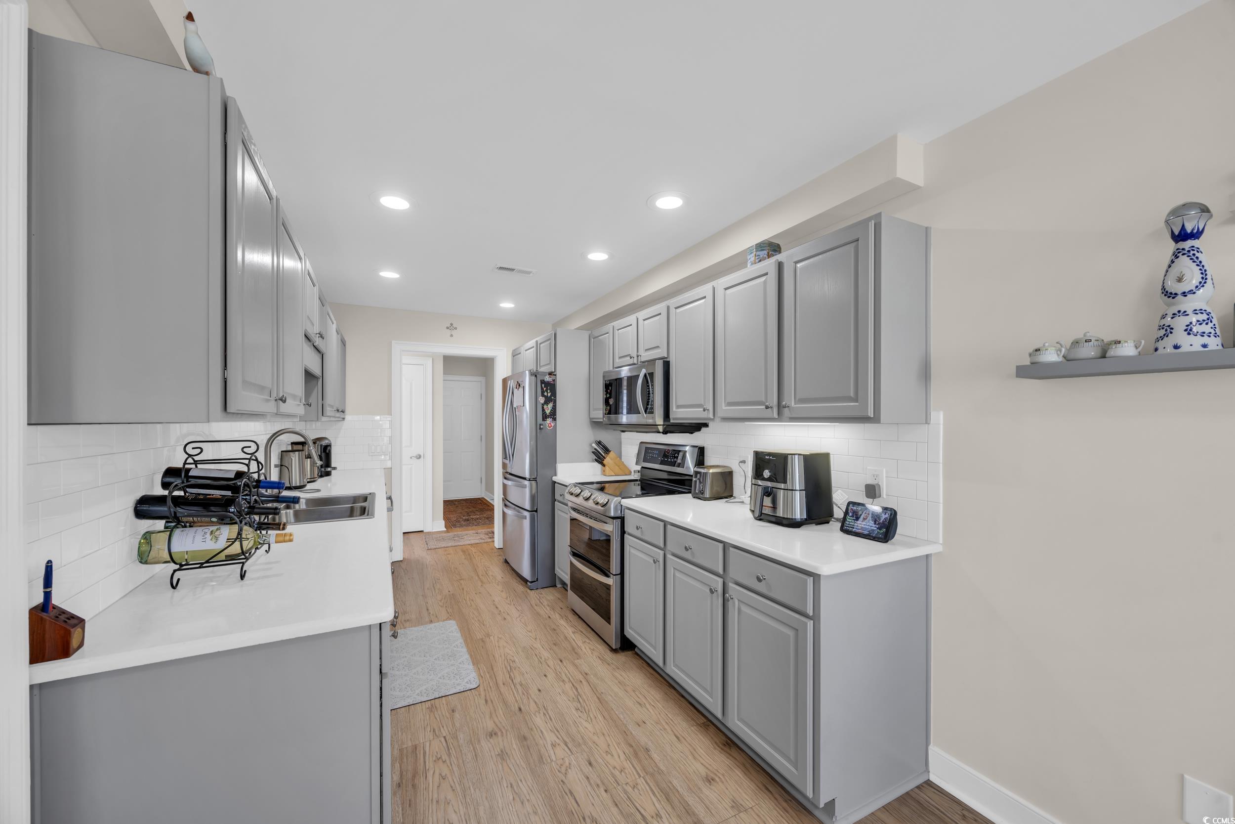 4208 Edgefield Road Little River, SC 29566 - Photo 16 of 33 Kitchen with light wood finished floors, appliance