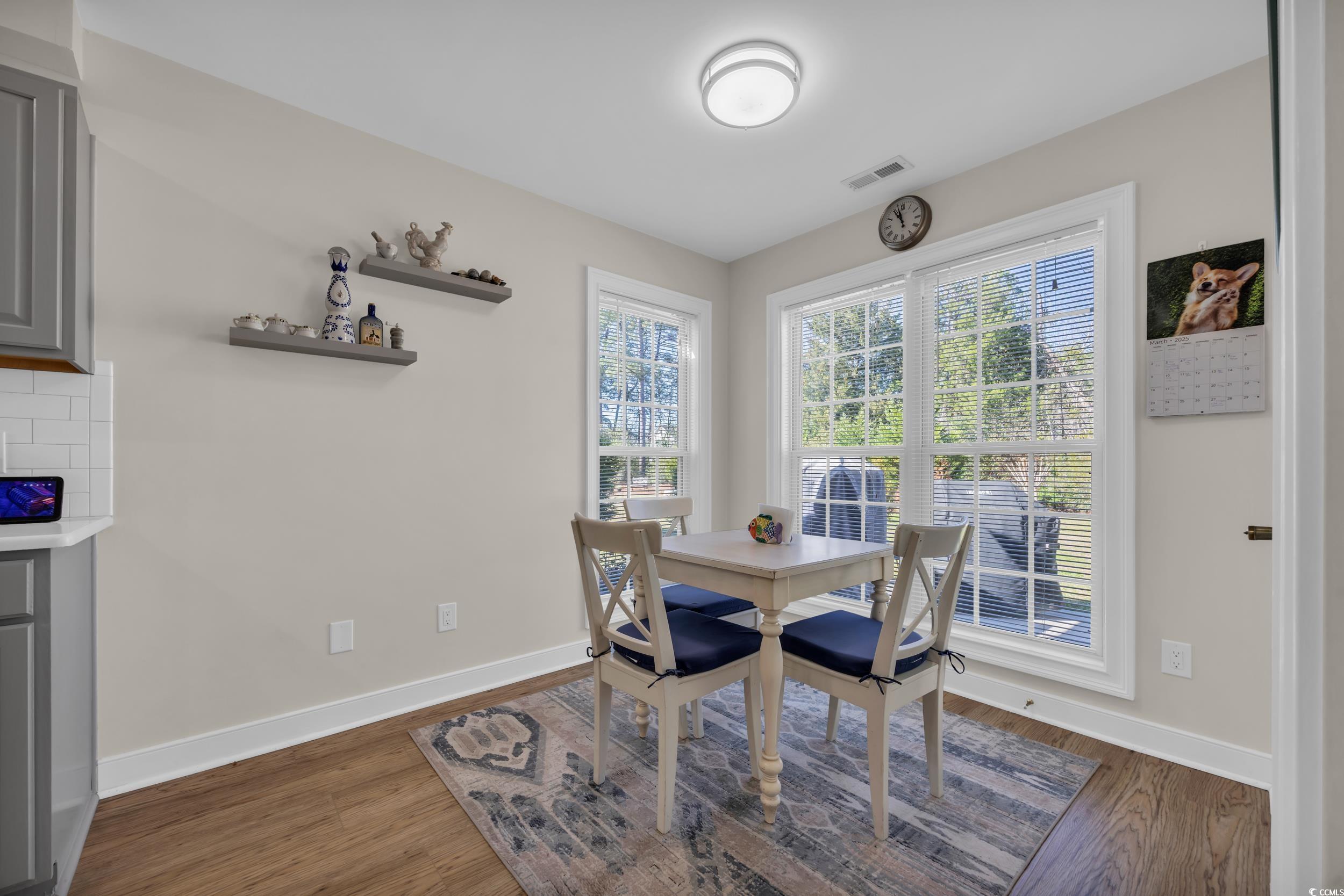 4208 Edgefield Road Little River, SC 29566 - Photo 17 of 33 Dining room with visible vents, baseboards, and wo