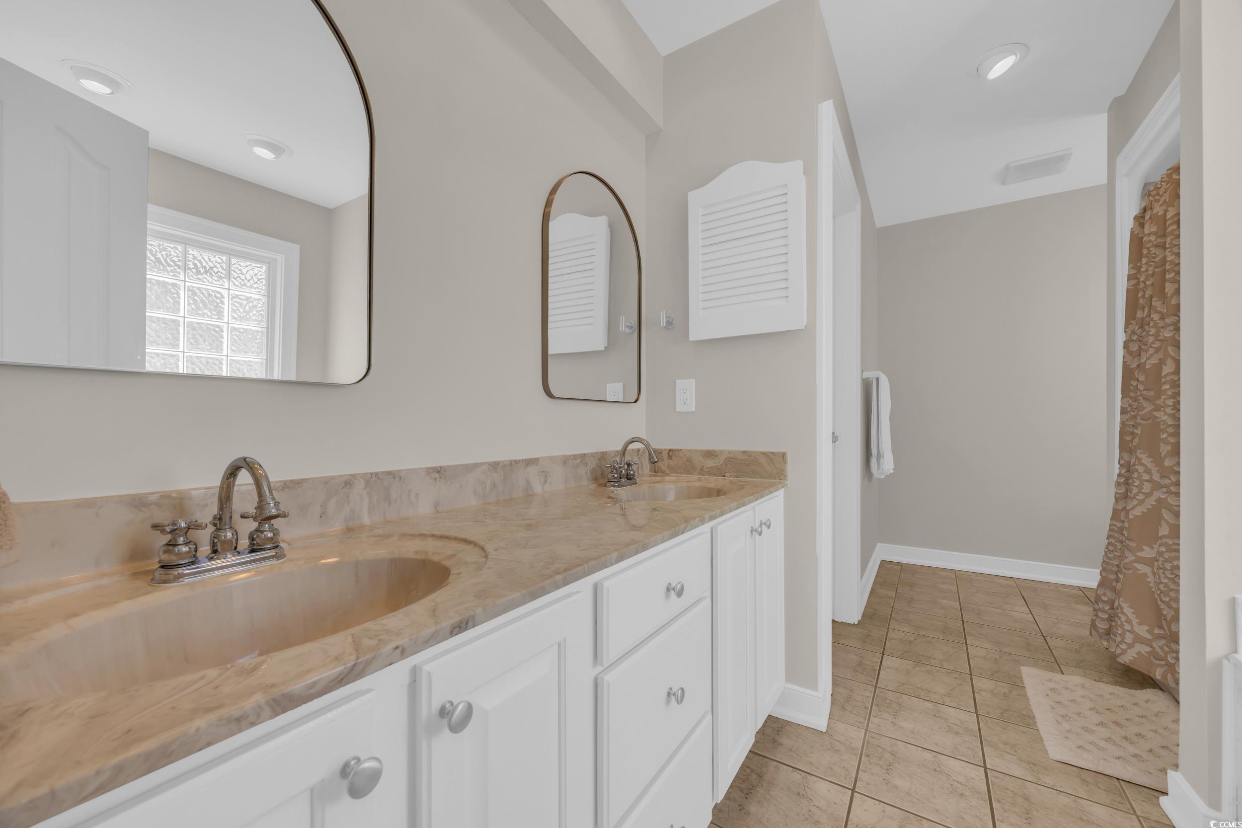 4208 Edgefield Road Little River, SC 29566 - Photo 19 of 33 Bathroom featuring a sink, visible vents, double v