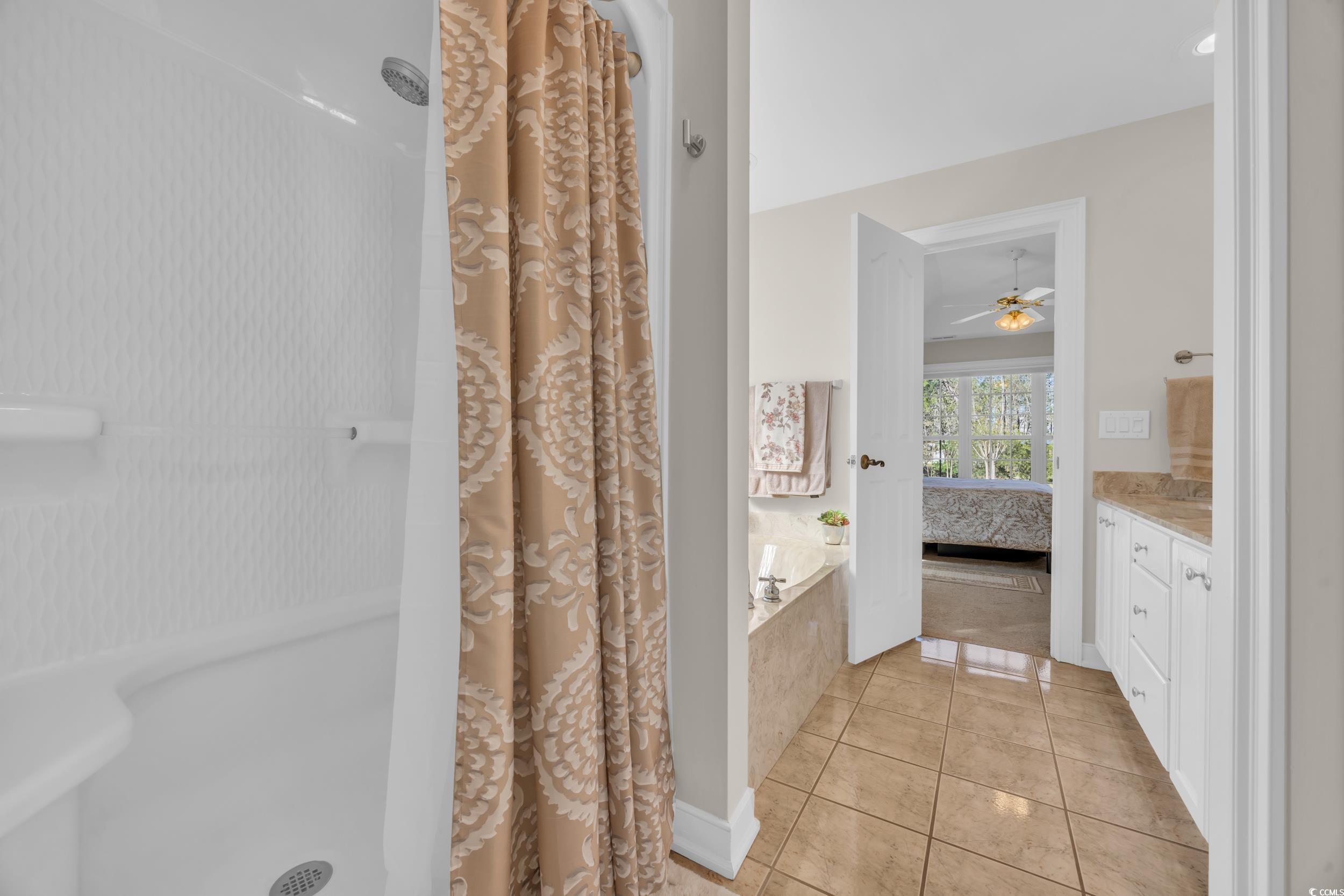 4208 Edgefield Road Little River, SC 29566 - Photo 20 of 33 Ensuite bathroom with tile patterned floors, a sho