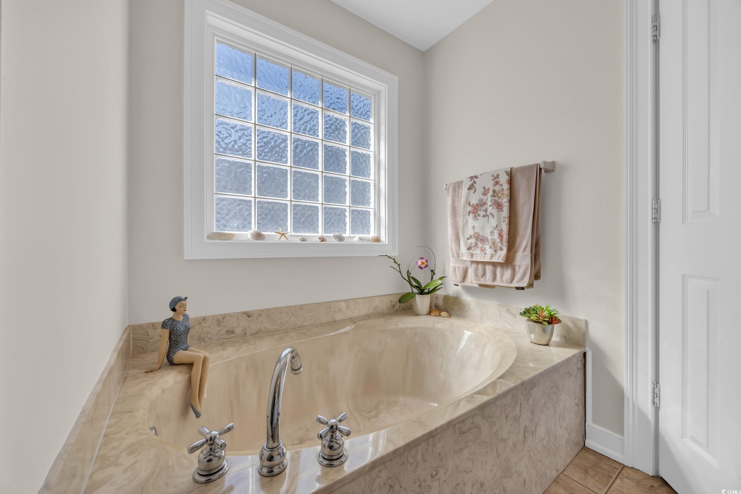 4208 Edgefield Road Little River, SC 29566 - Photo 21 of 33 Bathroom featuring tile patterned floors, a health