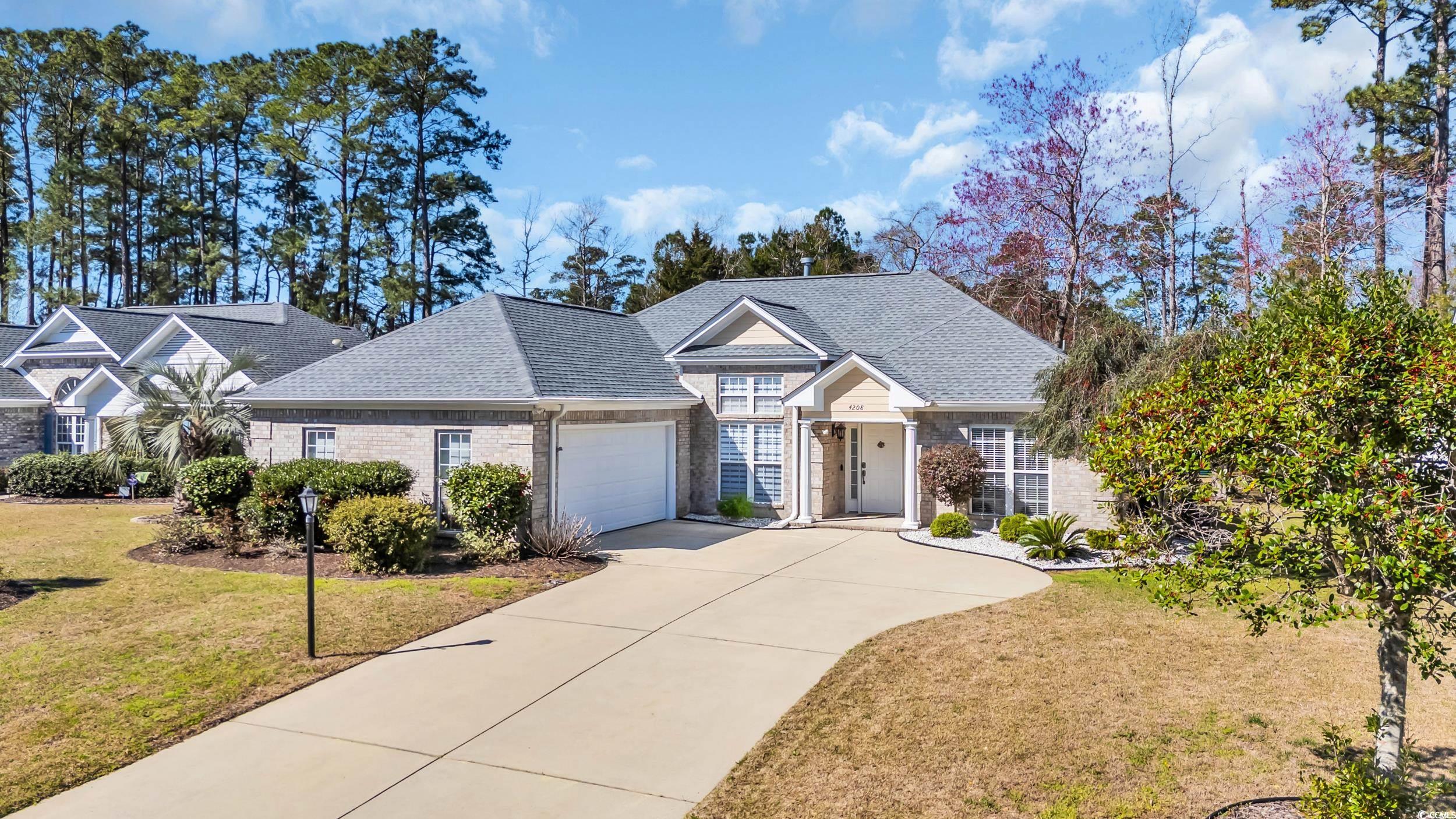 4208 Edgefield Road Little River, SC 29566 - Photo 3 of 33 View of front of house with driveway, roof with sh