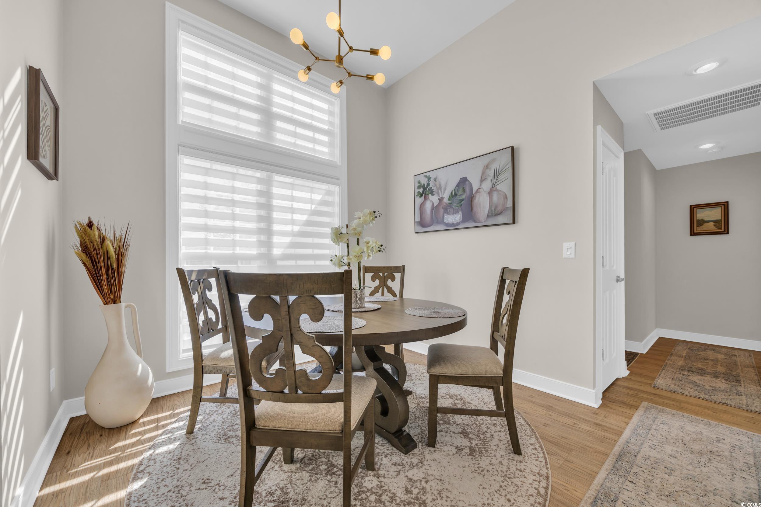 4208 Edgefield Road Little River, SC 29566 - Photo 7 of 33 Dining room featuring a notable chandelier, visibl