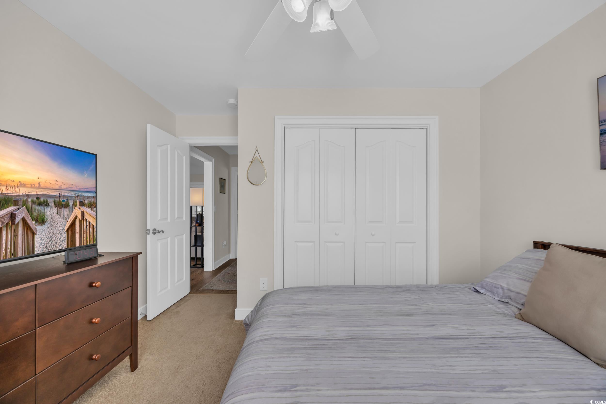 4208 Edgefield Road Little River, SC 29566 - Photo 9 of 33 Bedroom with a ceiling fan, light colored carpet,