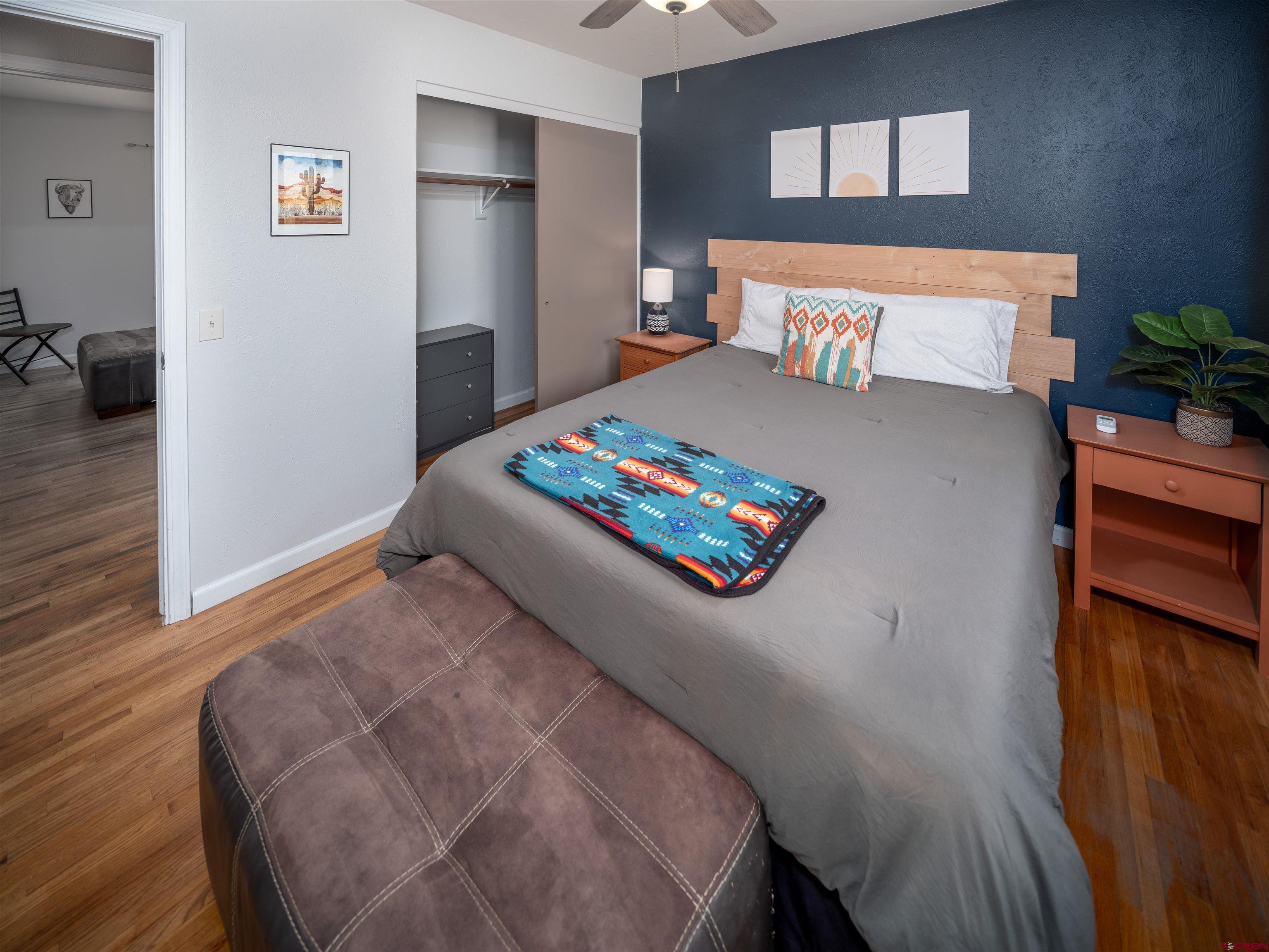 505 South Valley Road Cortez, CO 81321 - Photo 12 of 27 a bed room with a bed and a couch