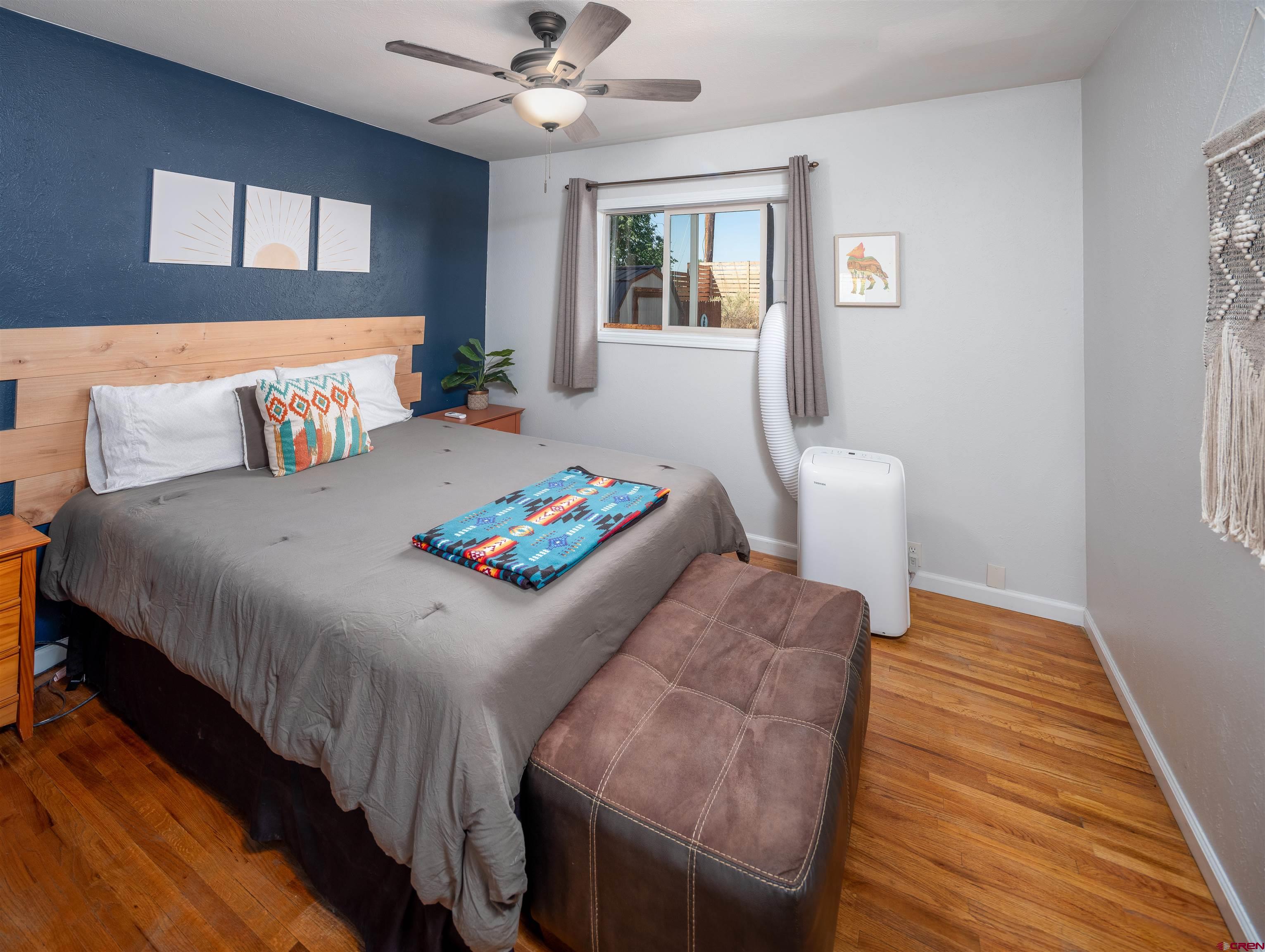 505 South Valley Road Cortez, CO 81321 - Photo 13 of 27 a bedroom with a bed and a table