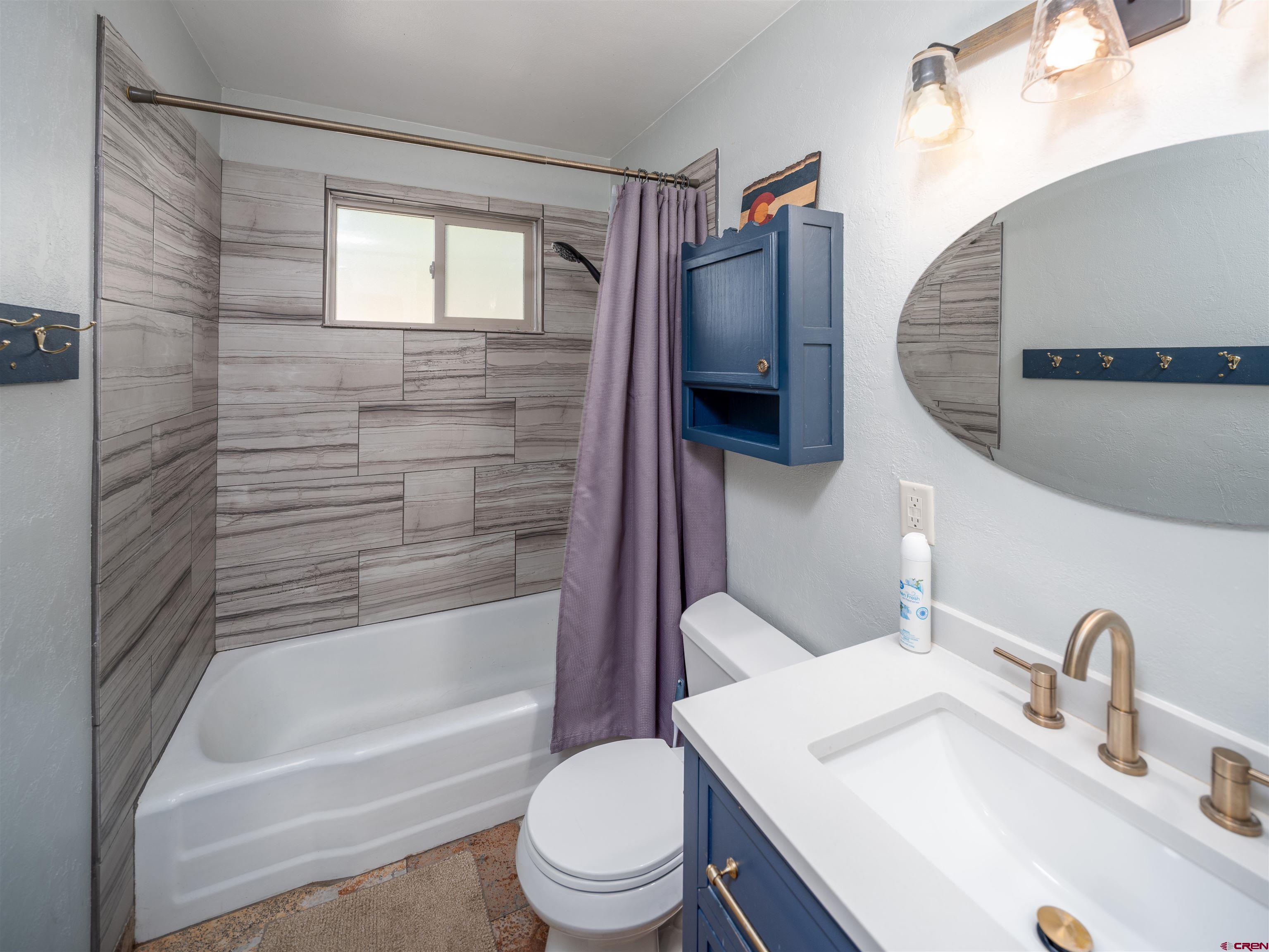505 South Valley Road Cortez, CO 81321 - Photo 17 of 27 a bathroom with a sink toilet and shower