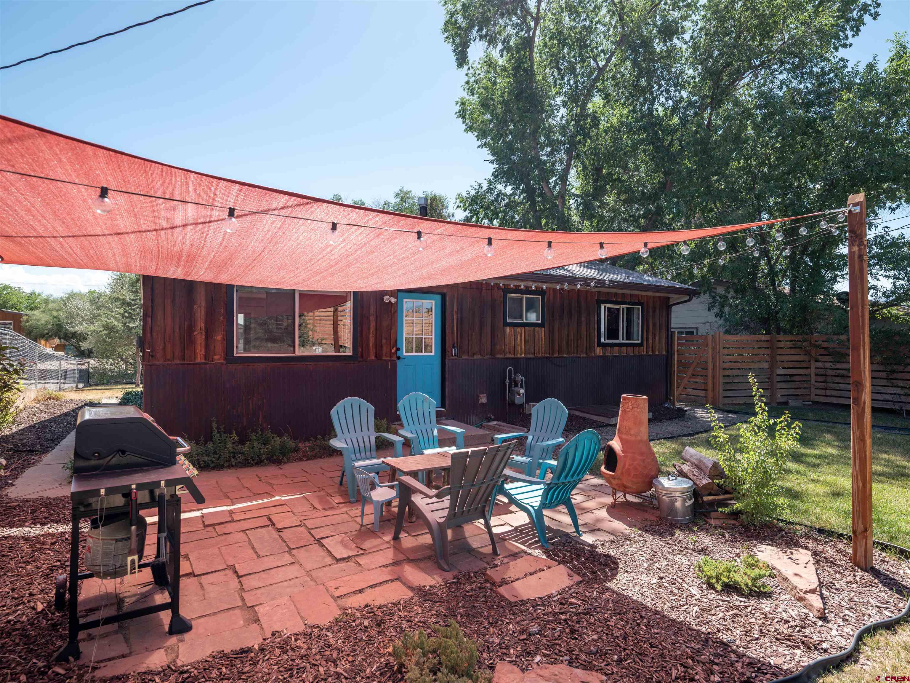 505 South Valley Road Cortez, CO 81321 - Photo 19 of 27 a view of a patio with table and chairs and potted plants