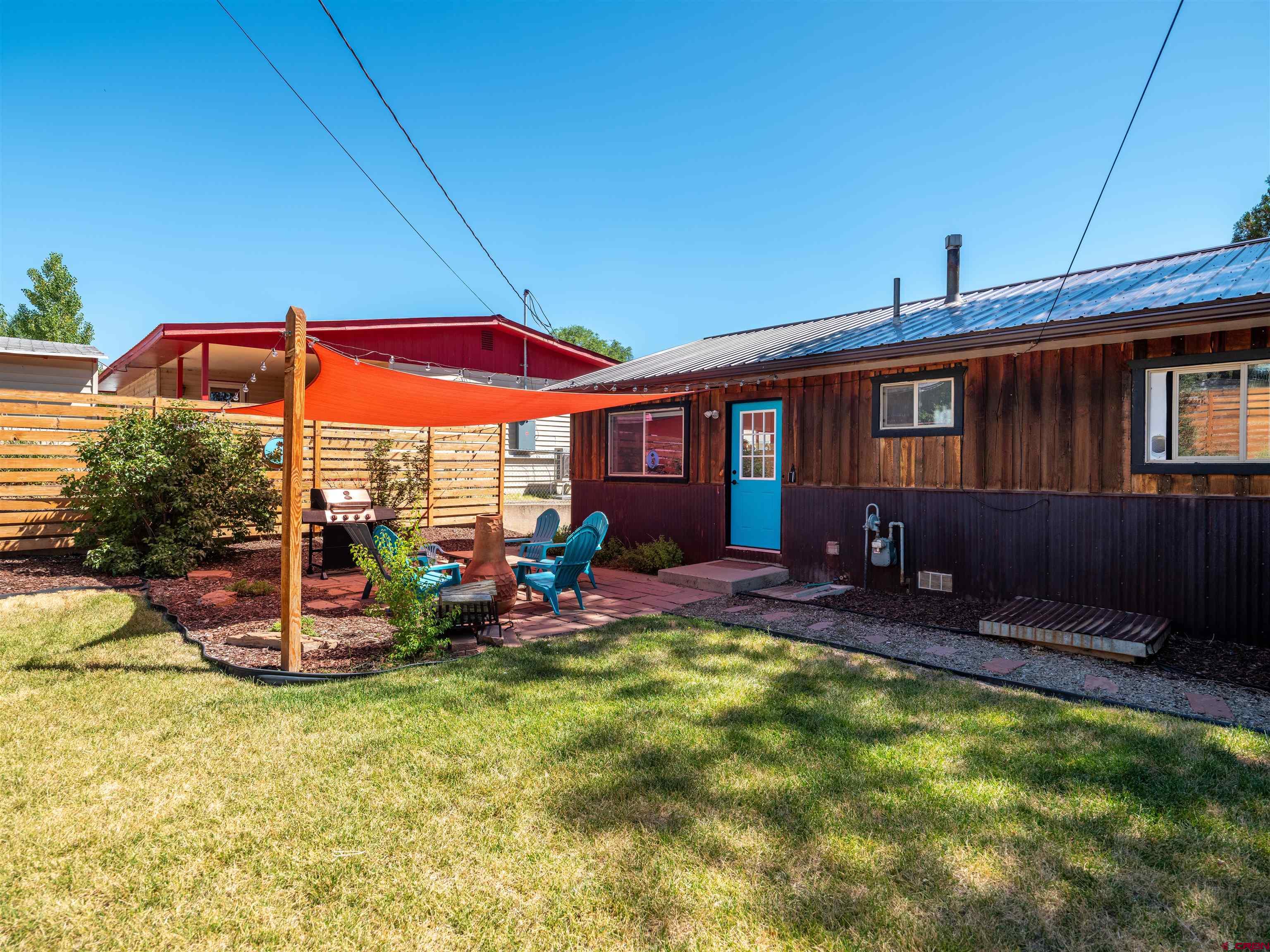 505 South Valley Road Cortez, CO 81321 - Photo 22 of 27 a view of a house with backyard porch and furniture