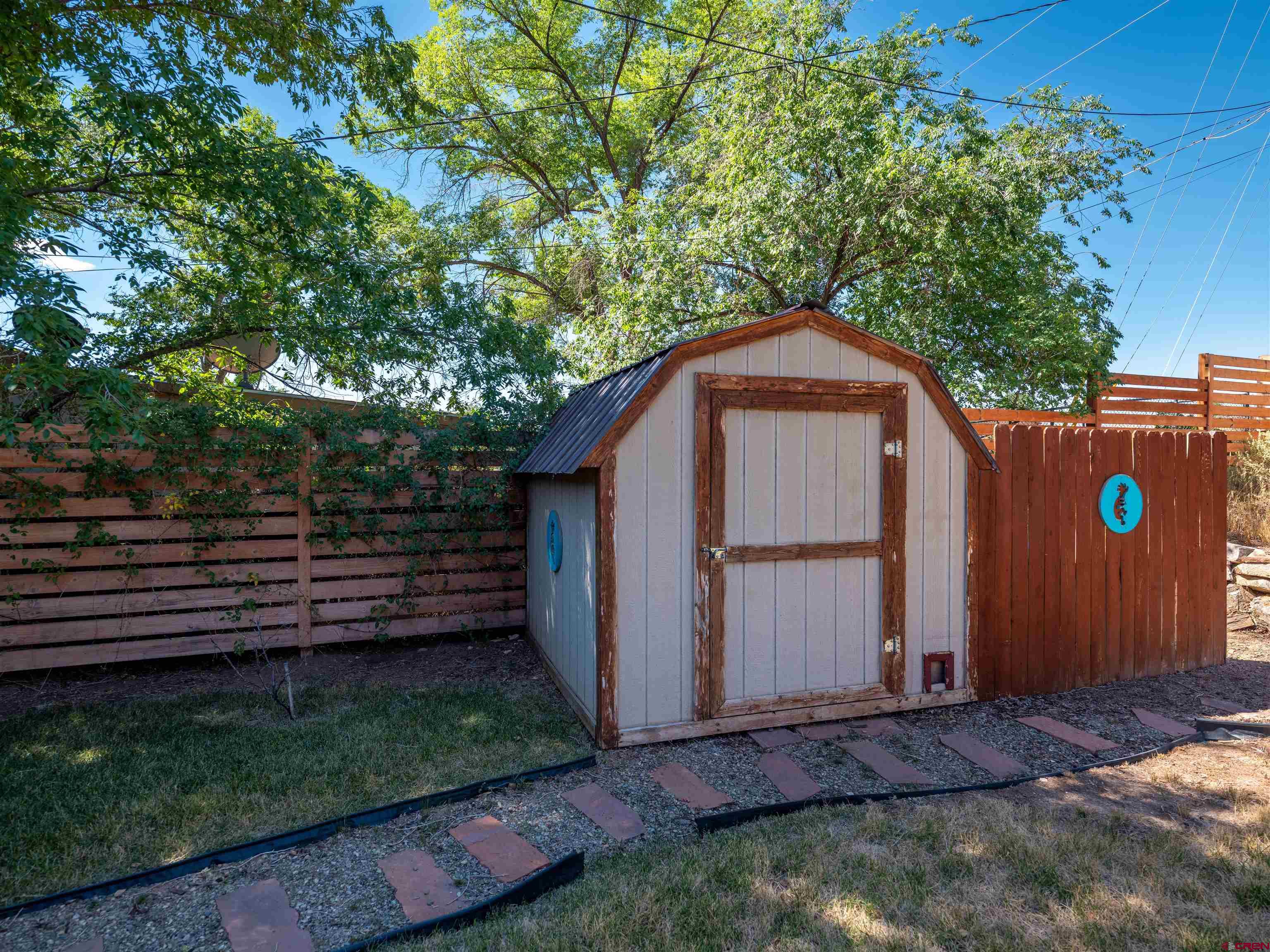 505 South Valley Road Cortez, CO 81321 - Photo 23 of 27 a backyard of a house with lots of green space