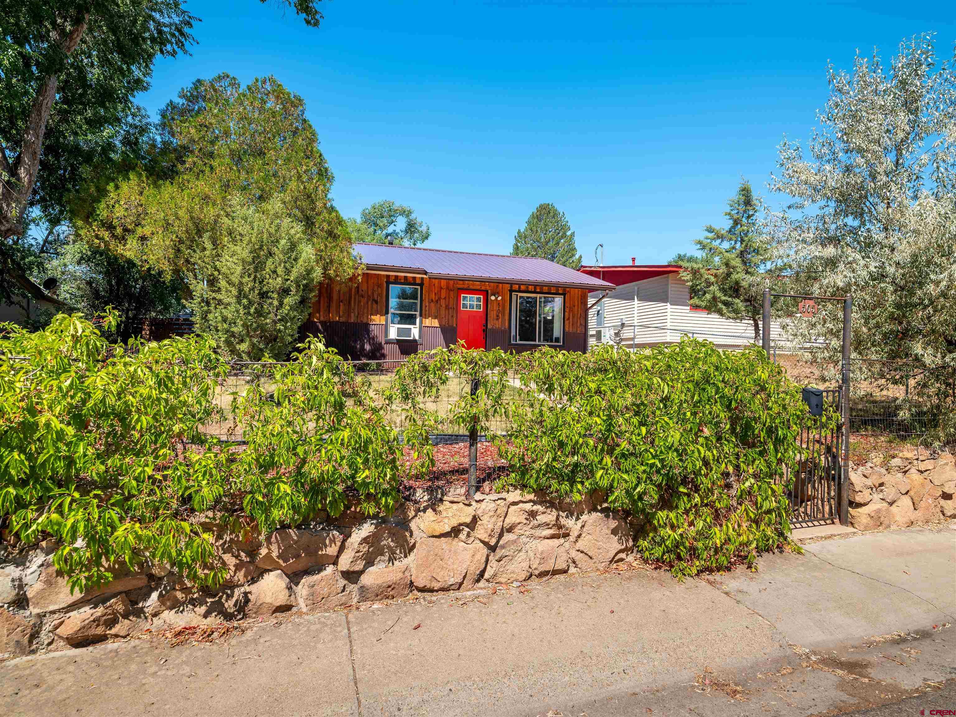 505 South Valley Road Cortez, CO 81321 - Photo 26 of 27 a front view of a house with a yard
