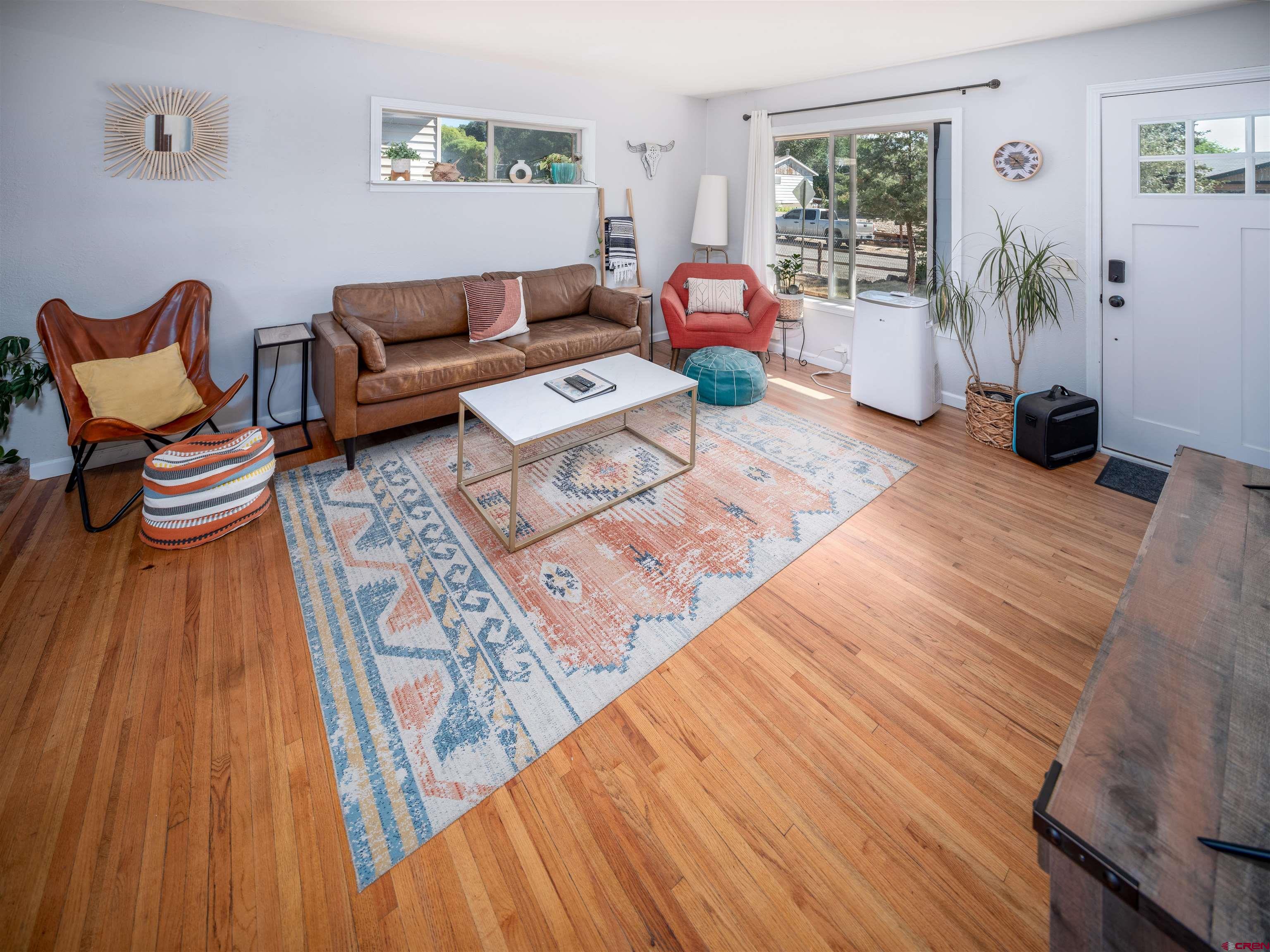 505 South Valley Road Cortez, CO 81321 - Photo 4 of 27 a living room with furniture and a wooden floor