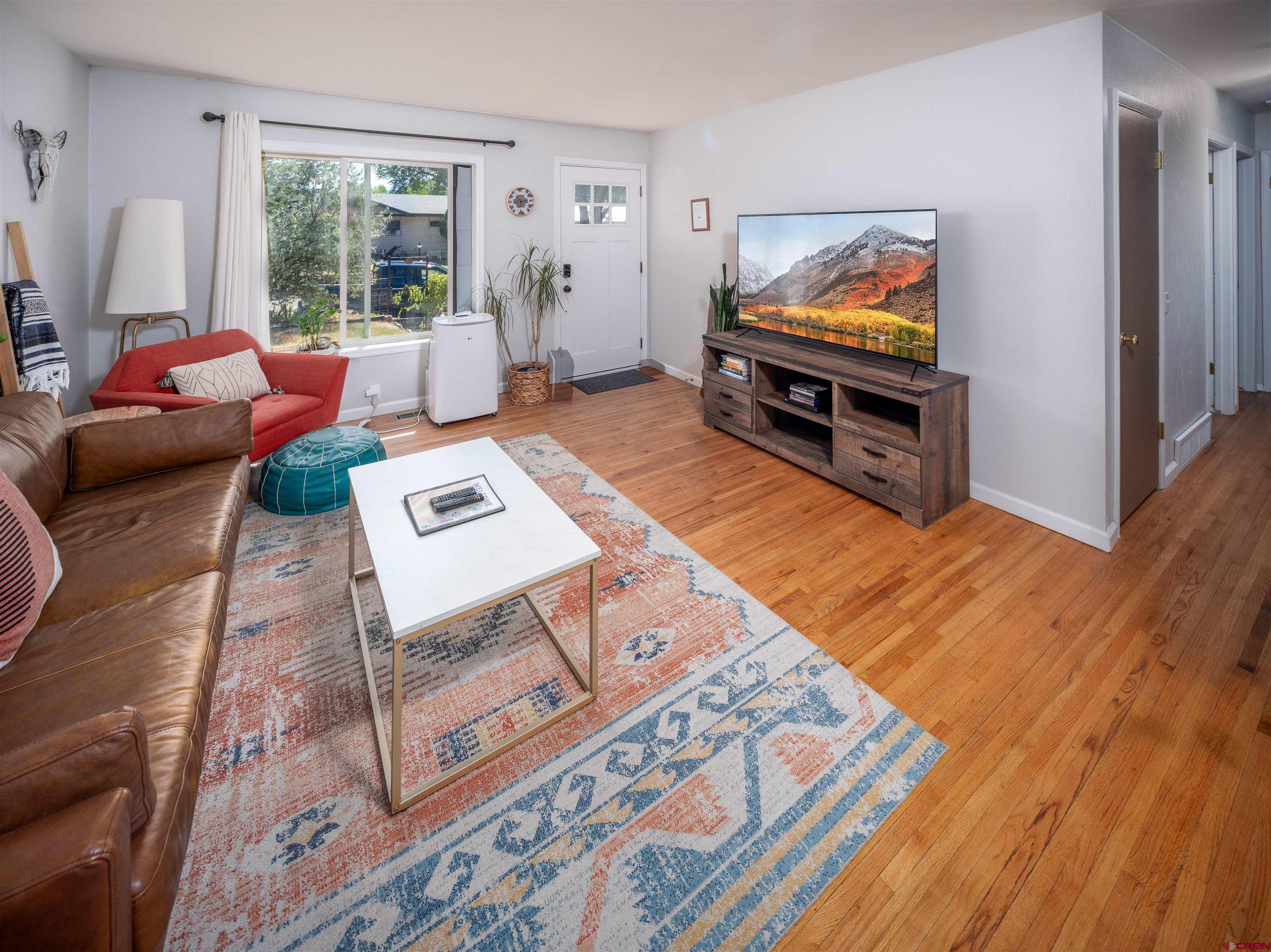 505 South Valley Road Cortez, CO 81321 - Photo 6 of 27 a living room with furniture and a flat screen tv