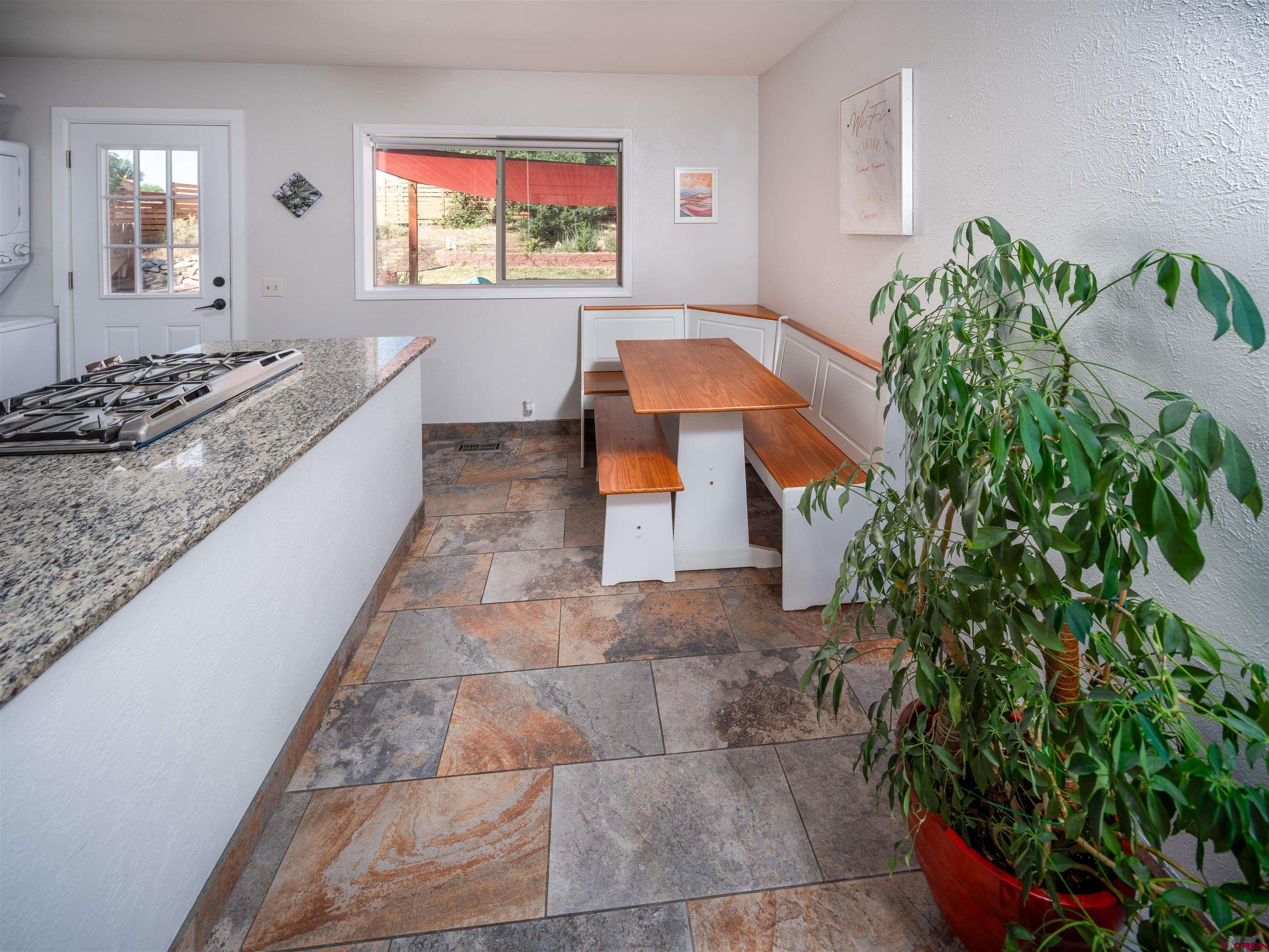 505 South Valley Road Cortez, CO 81321 - Photo 7 of 27 a bathroom with a granite countertop sink and a mirror