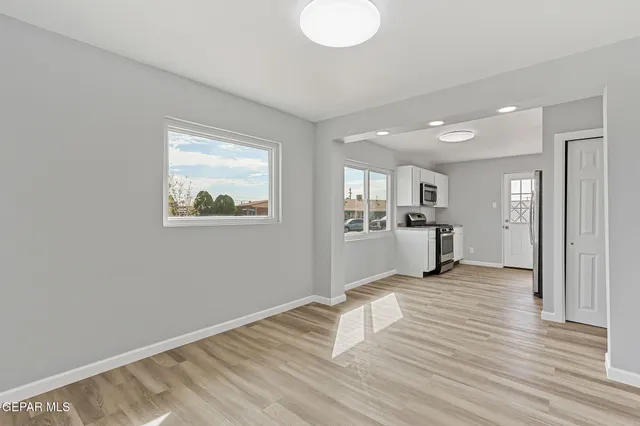 a bathroom with a sink a mirror and vanity