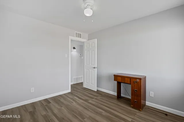 an aerial view of residential house with outdoor space and sign board