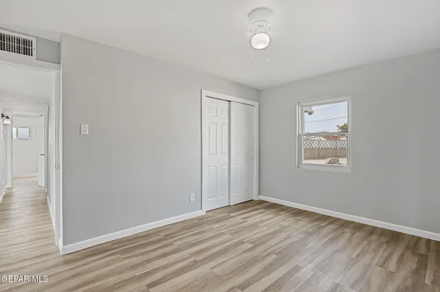 an aerial view of multiple houses with yard