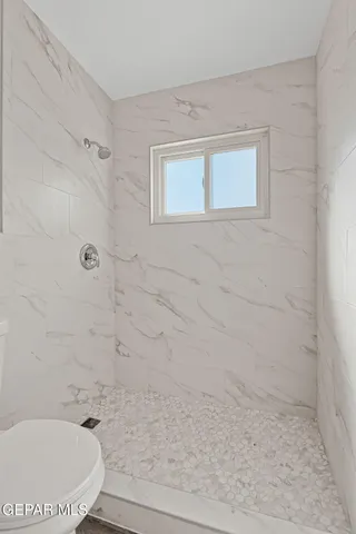 an aerial view of a house with outdoor space