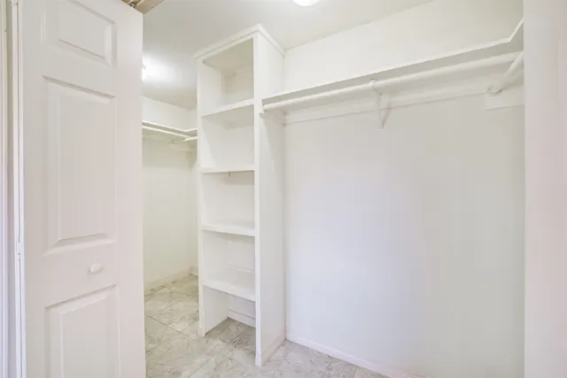 a spacious bathroom with sink shower and bathtub